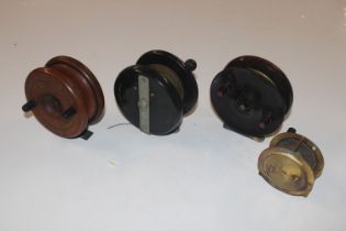 A brass Milbro fishing reel and ELO Bakelite fishi