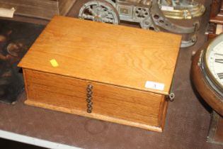 A golden oak collector's cabinet, fitted five draw