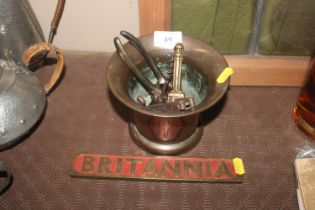 A bell metal mortar, cork screw, nut crackers and