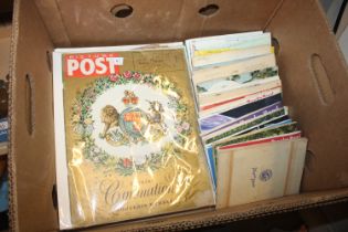 A box containing albums of cigarette and tea cards