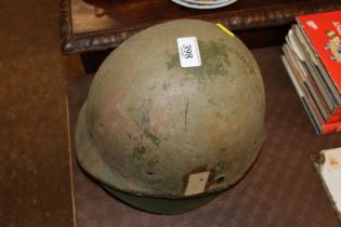 A Bosnian War steel helmet with US liner