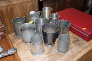 A collection of mostly pewter tankards