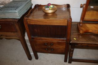 A Georgian mahogany tray top commode with tambour