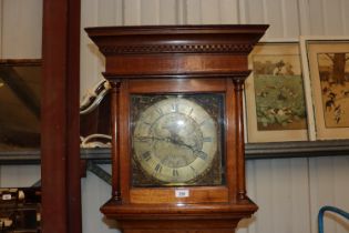 An antique oak long cased clock with brass 30 hour movement by Joseph Kember Shaw