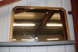 A gilt framed bevel edged overmantel mirror