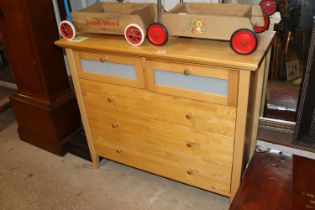 A modern chest fitted two short and three long drawers