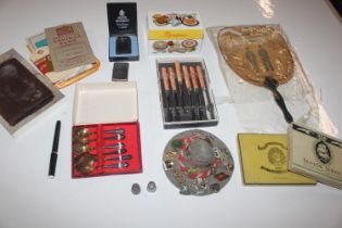 A wooden tray and contents including a fan AF; var