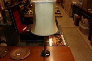 A brass and faux marble based table lamp and shade