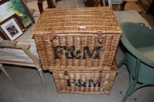 A pair of F&M wicker baskets