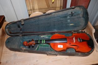 A violin in case with bow