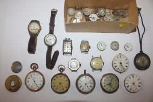 A box containing various wrist watches and pocket