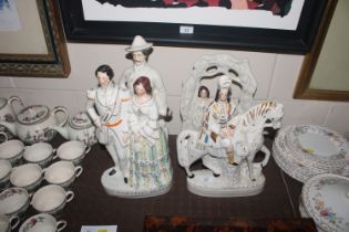 A collection of Staffordshire flatback figures to