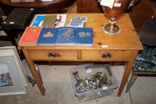 A stripped pine side table fitted two drawers