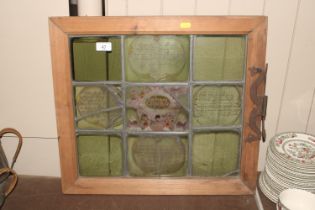 A leaded and stained glass panel with painted deco