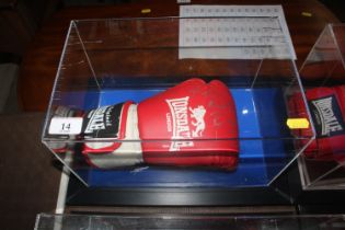 A cased boxing glove signed by Ricky Hatton