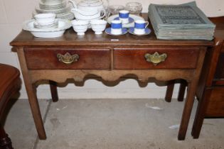 A Georgian oak side table fitted two drawers