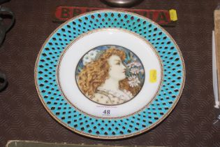 A Minton Art Pottery plate having portrait decorat