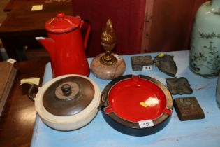 A red enamel coffee pot; a red and black glazed as