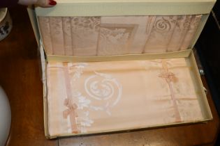 A vintage boxed table cloth and napkin set