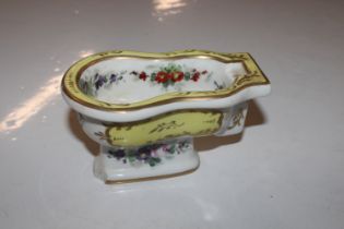 A porcelain floral and gilt decorated bidet, mark sevres style to base, AF