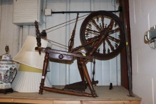 An antique spinning wheel AF