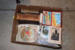 A box of miscellaneous vintage puzzles, books, Rup