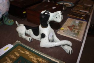 A black and white model of a dog, makers initials