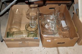 Two boxes containing glass vases