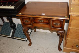 A Georgian style low boy fitted three drawers