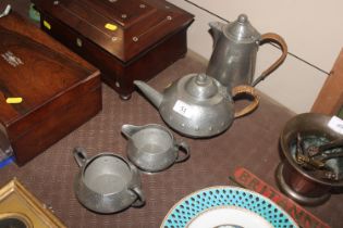 A Unity pewter four piece tea set, tea pot numbere