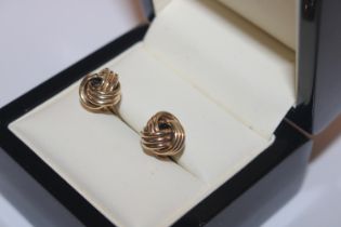 A pair of 9ct gold knot ear-rings, approx. 1.5gms