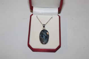 A large Sterling silver Pietersite pendant and cha