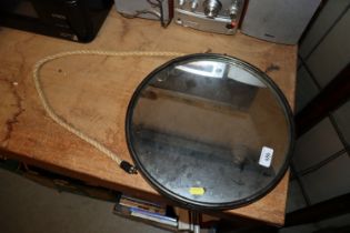 A round metal framed mirror