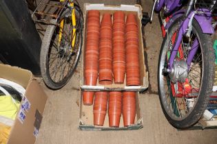 Two boxes of plastic flower pots