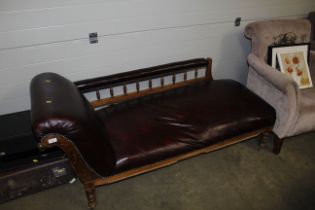 A leather upholstered chaise longue