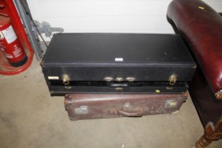 A vintage suitcase and a music case