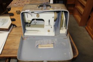 A Bernina sewing machine in fitted case, sold as a