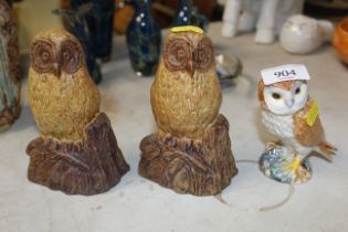 A pair of Bernard Rooke pottery owls and a Beswick