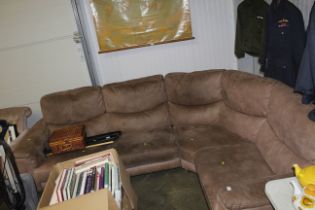 A brown upholstered corner sofa