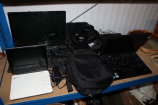 An Acer laptop, a ThinkPad laptop, portable DVD pl