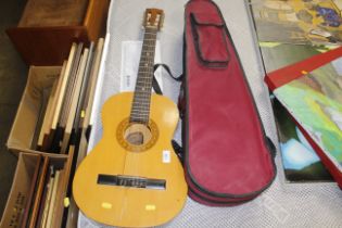 An Encore acoustic guitar together with a 'The Ste