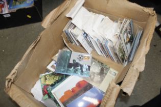 A box containing various postcards