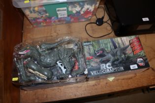 Two remote control velociraptor toys