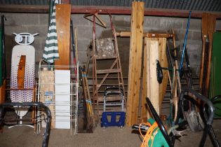 A wooden step ladder and a folding trolley