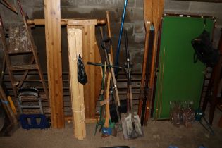 A collection of garden tools including shovels; an