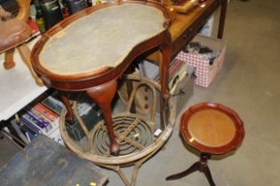 A bamboo and wicker occasional table with glass to