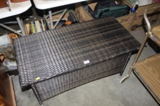 A woven plastic garden table