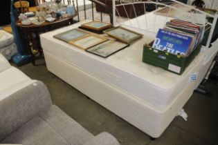 A single divan bed with a Myers mattress