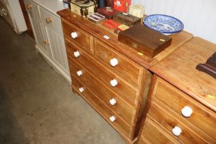 A hardwood chest fitted two short over three long drawers