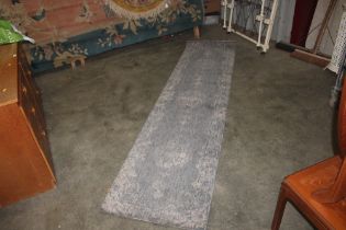 An approx. 8'11" x 2'2" John Lewis modern grey rug